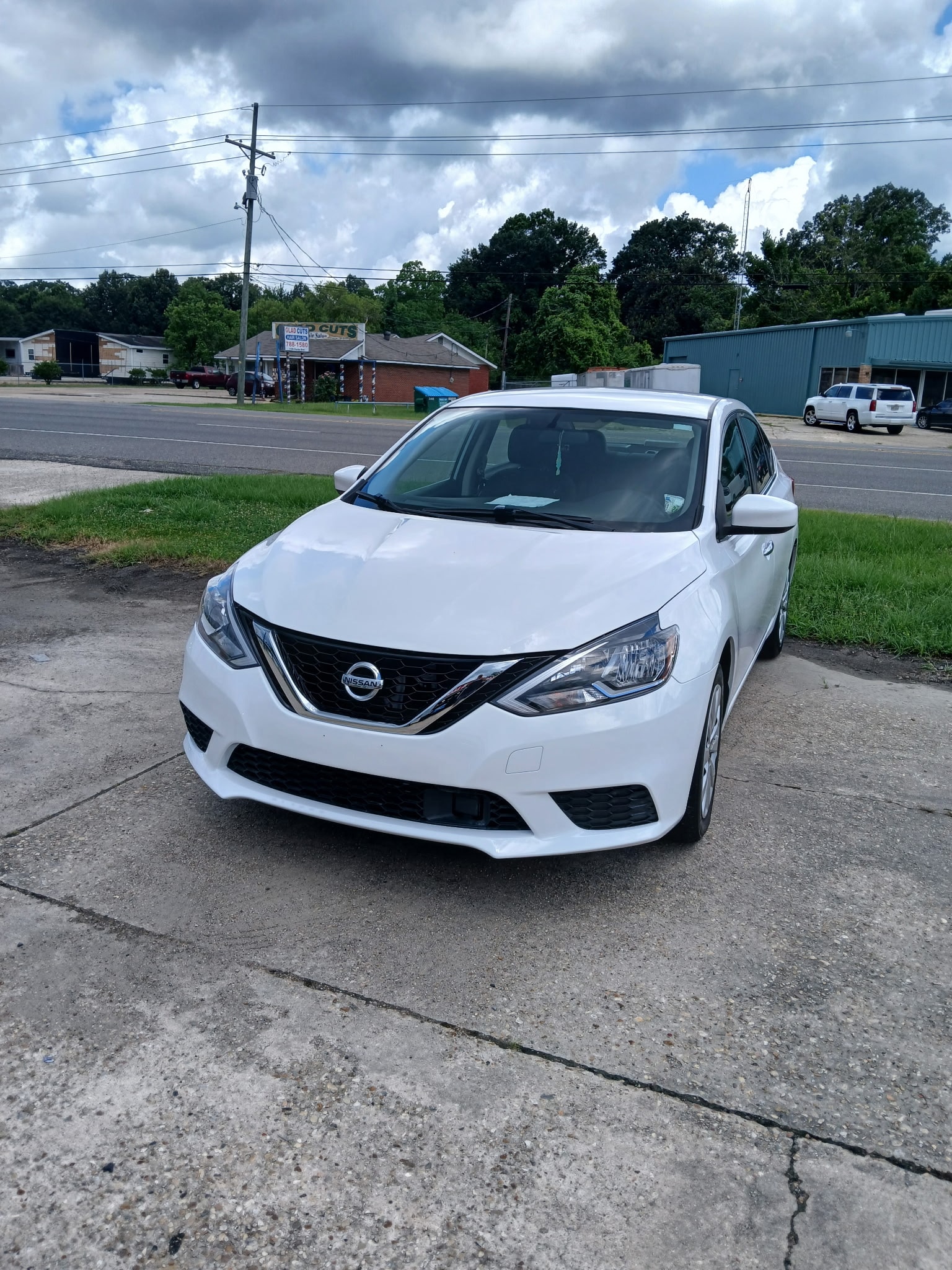 White Nissan Sentra after collision repair