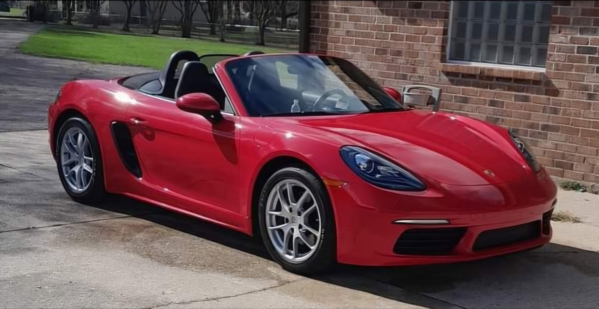 Red Porsche 718 Boxster serviced at Expert Collision LLC
